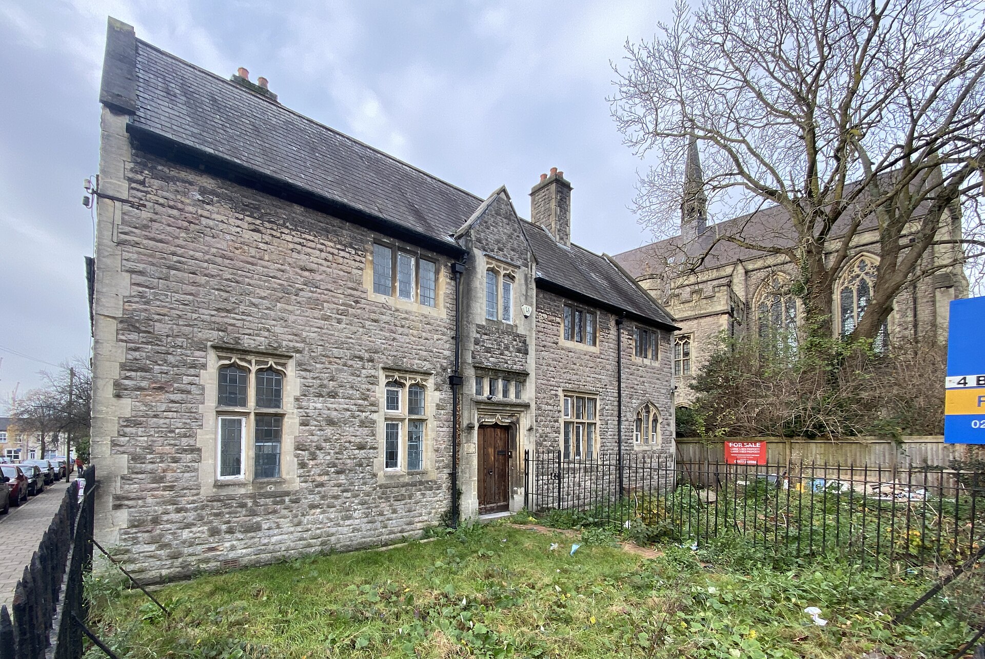 Boro Bari, a grey stone building with mullioned windows in Adamsdown.