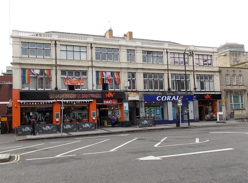 A three-storey building with bars and shops on its ground floor in Cardiff.