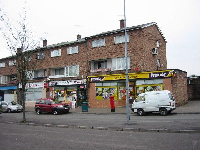 The parade of shops on Fishguard Road with flats above.