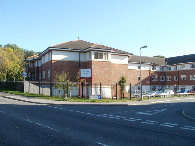 Ty Enfys, a red-brick and white-rendered building on a corner in Pentwyn.