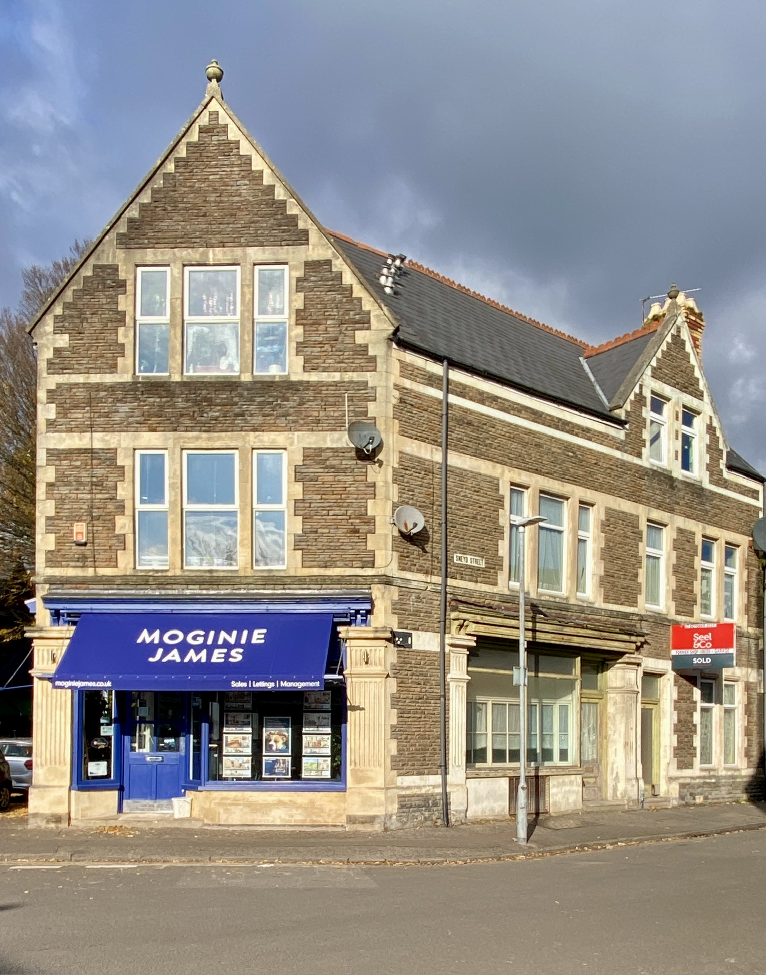 A stone-fronted corner building with an estate agent's shop in Pontcanna.
