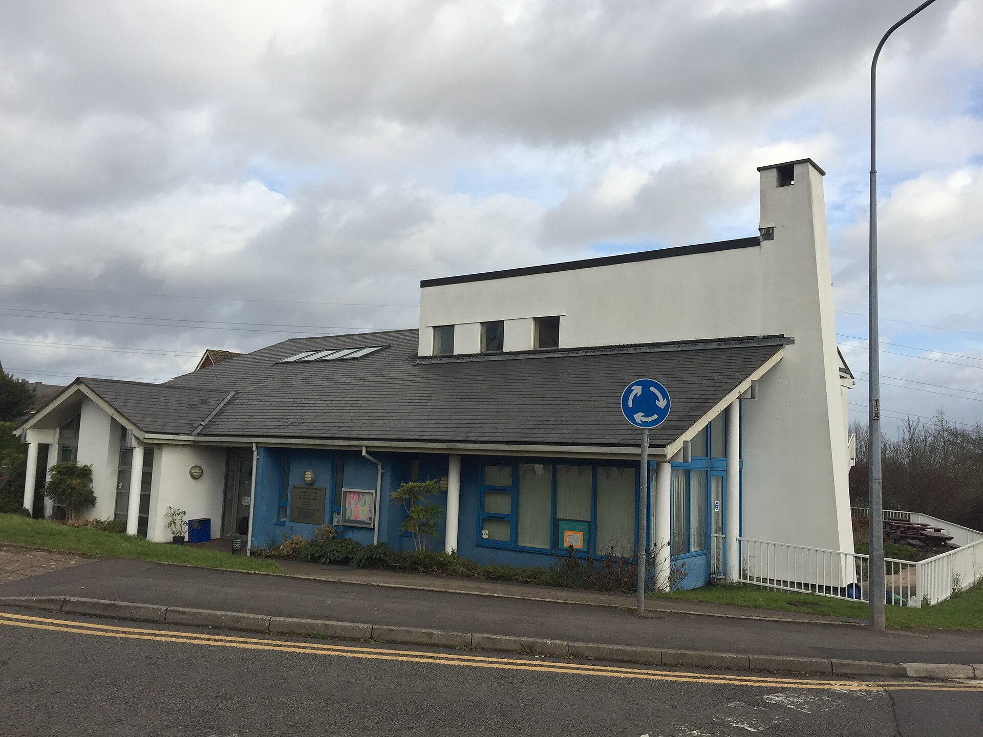 Pontprennau Community Church Centre, a white building with a tall chimney.