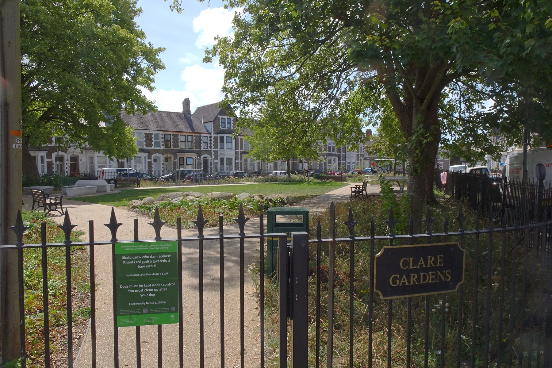 Clare Gardens in Riverside, a small park behind railings with terraced houses beyond.