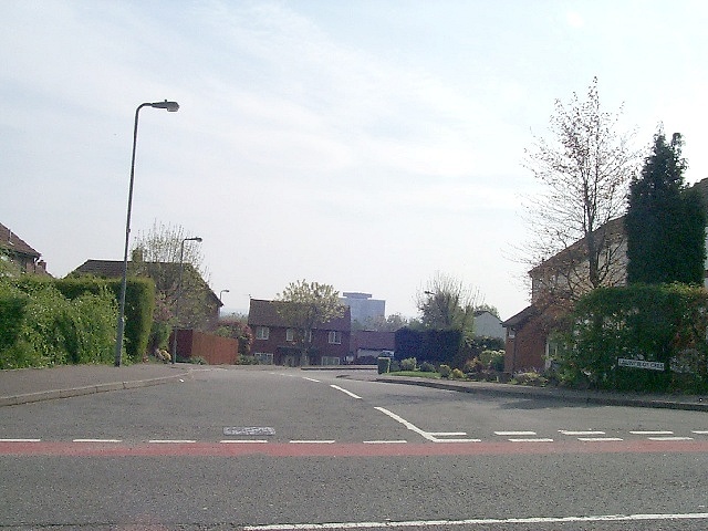 Lancelot Crescent in Thornhill, a quiet road junction with houses and hedges.