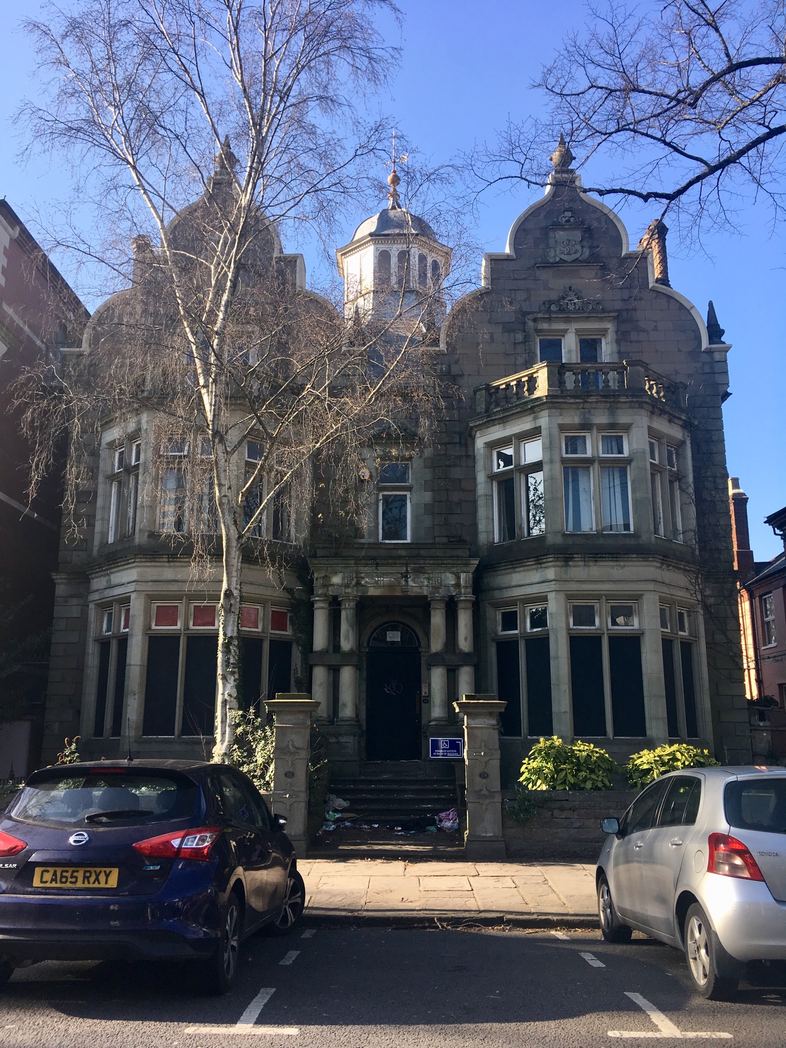 An ornate stone villa with domed bay windows in Tredegarville.