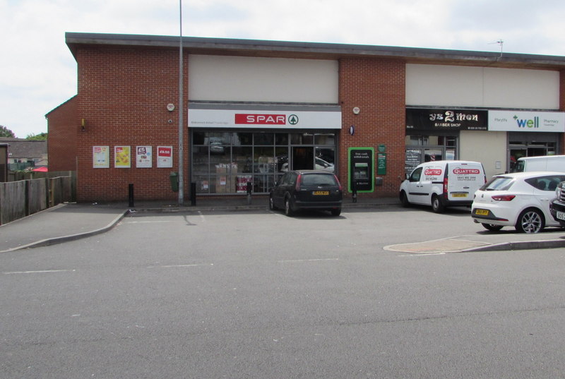 The Spar shop and neighbouring units with a car park in Trowbridge.