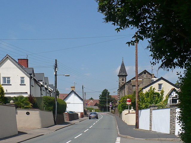 Marshfield Road in Castleton, with houses and a church spire along the road.