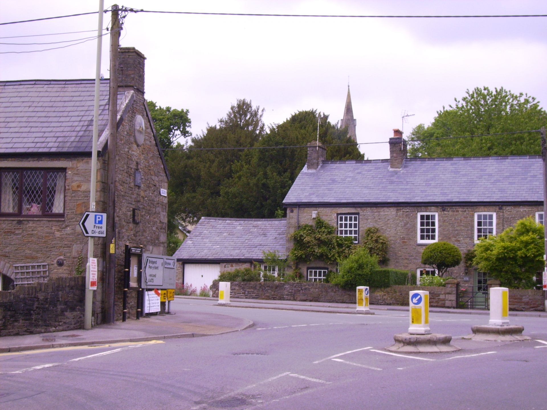 The town square in Llanharan with stone cottages, seen from Bridgend Road.