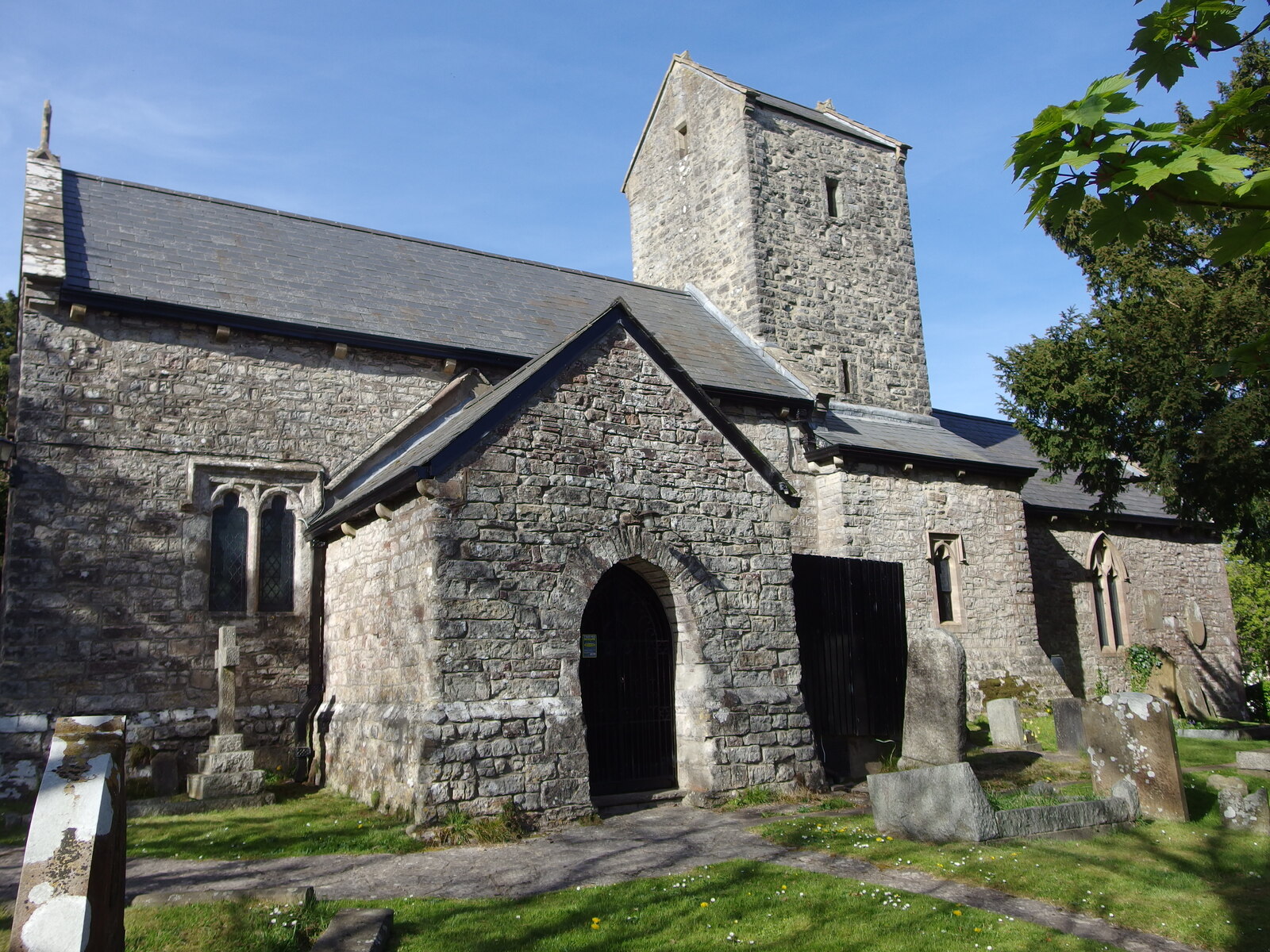 The medieval stone Church of St Michael in Michaelston-le-Pit, with its churchyard.