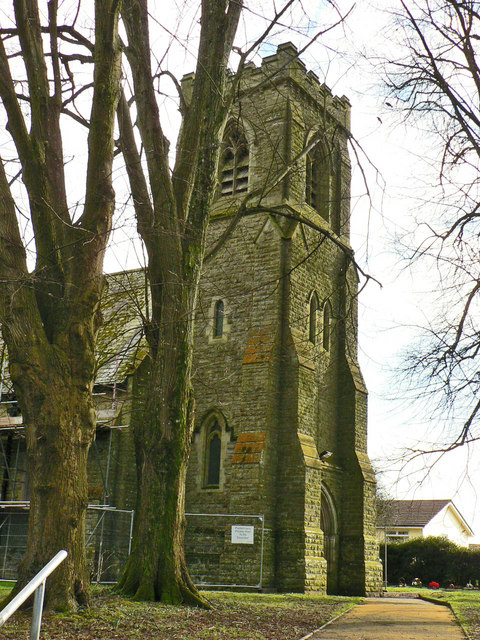 St David's Church in Miskin, a stone church with a square tower among trees.
