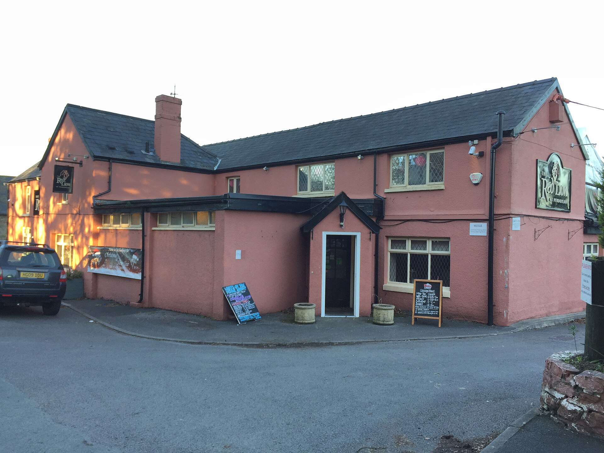 The Red Lion pub in Pendoylan, a pink-painted building with a slate roof.