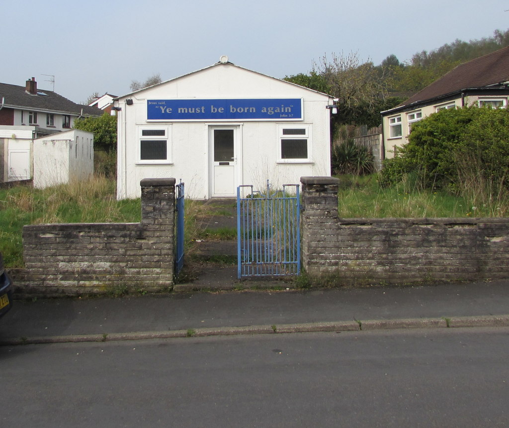 Rhiwderin Free Presbyterian Church, a small white chapel behind a stone wall.