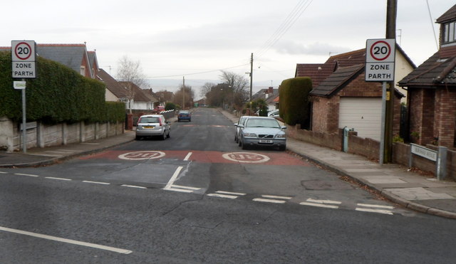 Burnham Avenue in Sully, a residential street of houses with 20 mph zone signs.